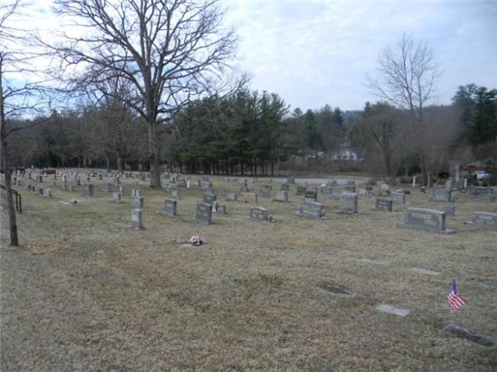 Photo overlooking several dozen plots at Oakdale Cemetery
