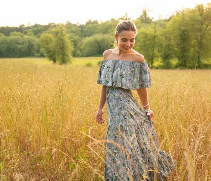 girl in field wearing a dress