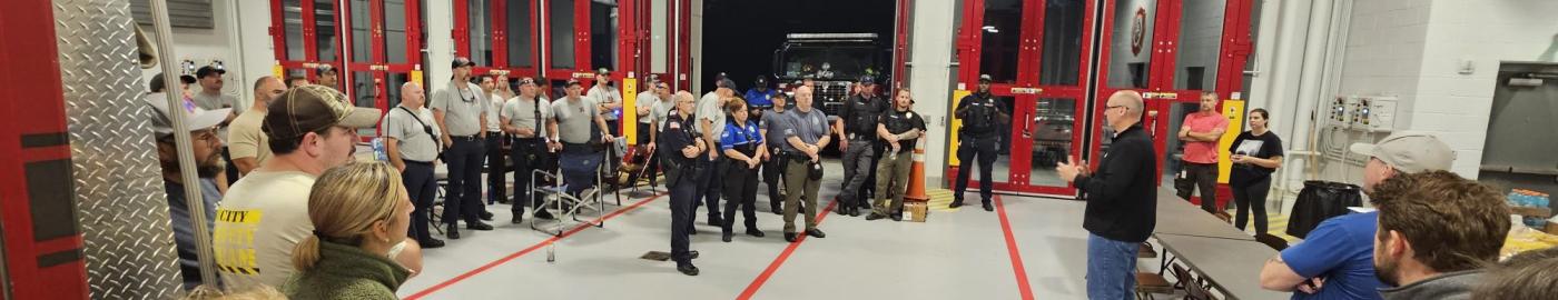 City Manager gives speech to group of employees at the fire station