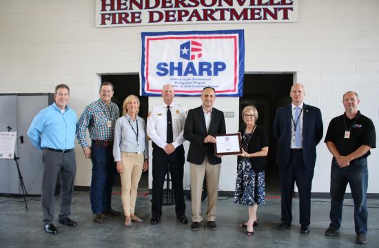 group of people with certificate