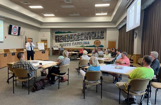 fire chief talking to group of people at a meeting
