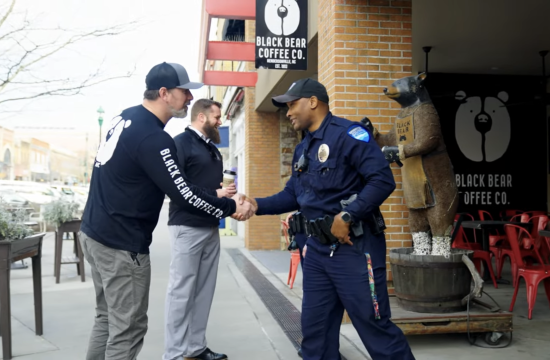 officer shaking hands with community member