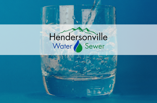 Glass of water with Hendersonville Water and Sewer Logo