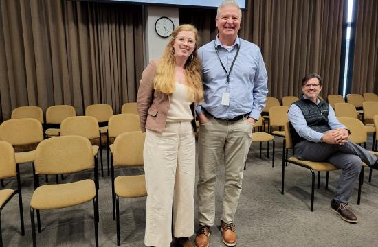 Caitlyn Gendusa and Tom Wooten standing and smiling