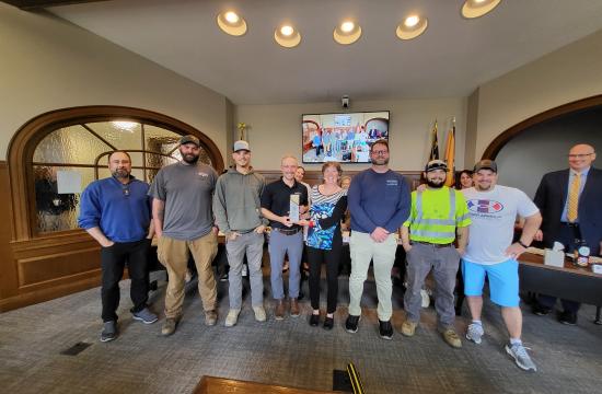 Group of Water and Sewer Employees accepting the Environmental Sustainability Hero Award
