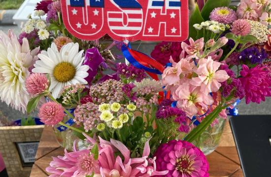flowers with a USA sign sticking out of it