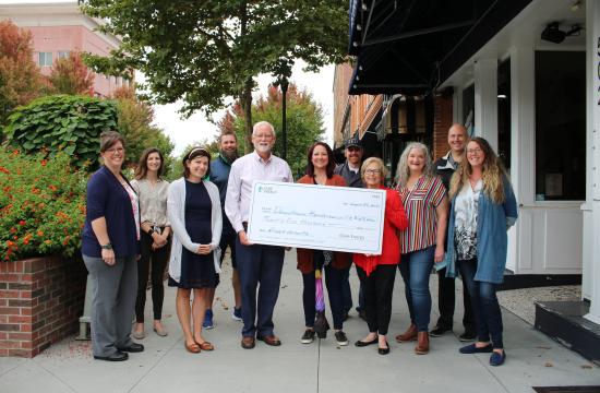 downtown board members and Duke Energy Foundation check