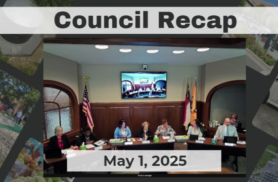 City Council members sit at dais.