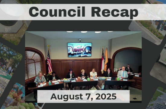 Council Members sitting at dais. 