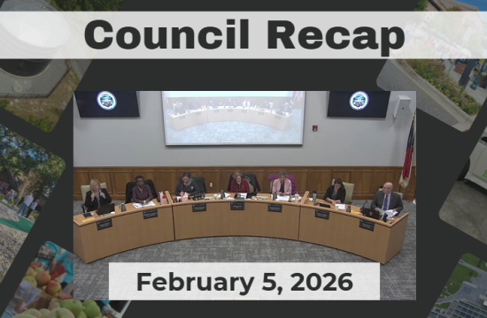 City Council members sit at dais. 