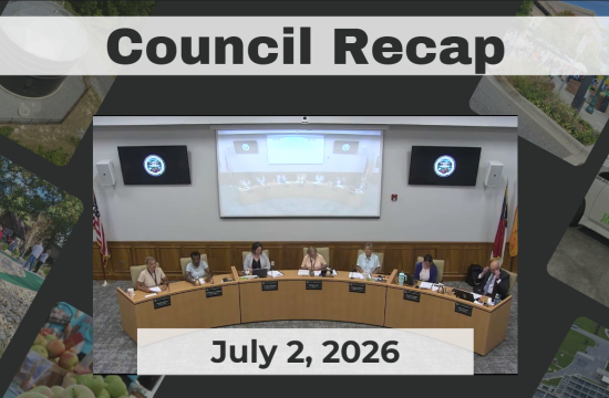Council members are seated around a dais.