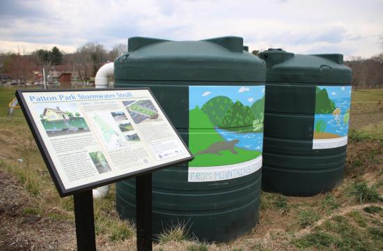 sign and 2 rainwater cisterns