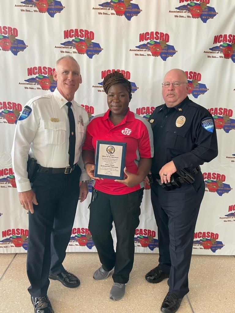 police chief and 2 officers with an award