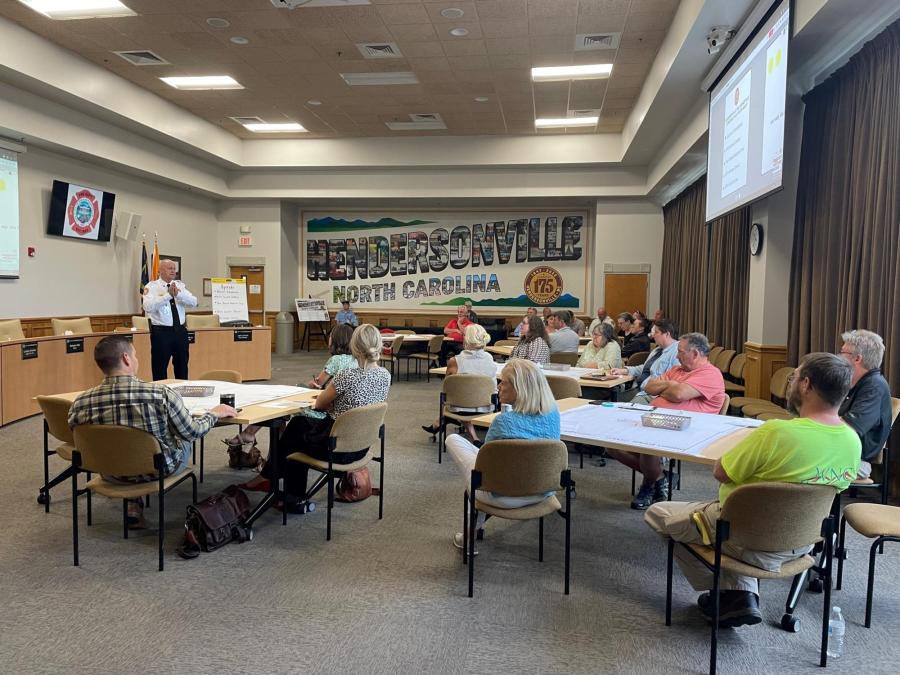 fire chief talking to group of people at a meeting