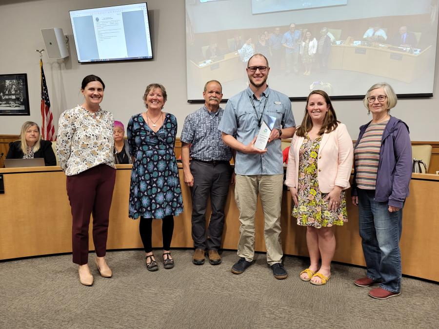 Mike Huffman smiling, standing with five individuals from the Hendersonville Sustainability Board.