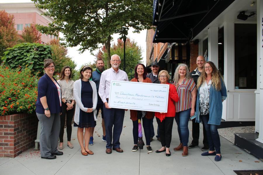 downtown board members and Duke Energy Foundation check