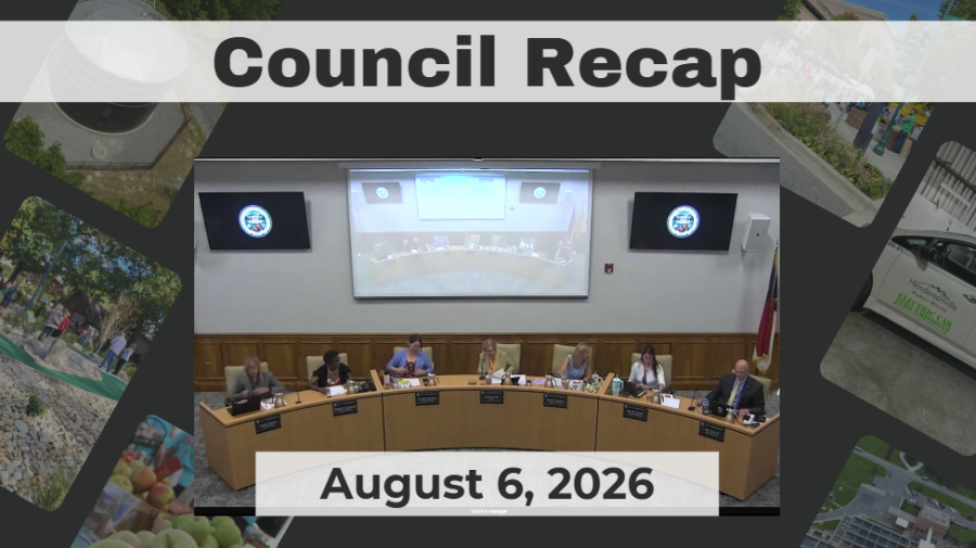 Council members are seated around a dais.