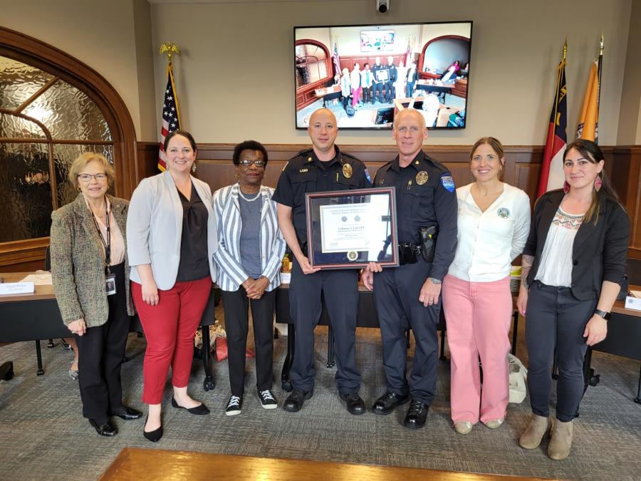 City Council stands with Captain Trae Laws and Chief Blair Myhand.