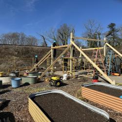 Habitat for Humanity volunteers building pergola at garden