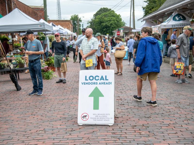 Crowd of people shopping at the Hendersonville Farmers Market