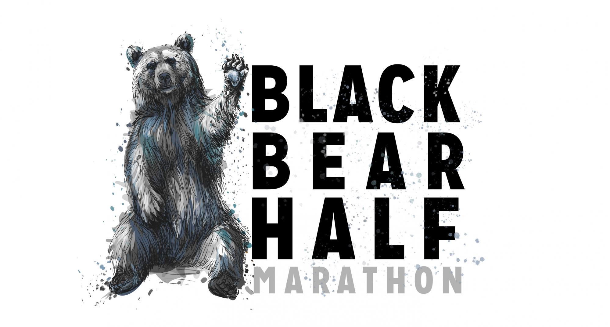Painted black bear sitting next to the words "Black Bear Half Marathon" 