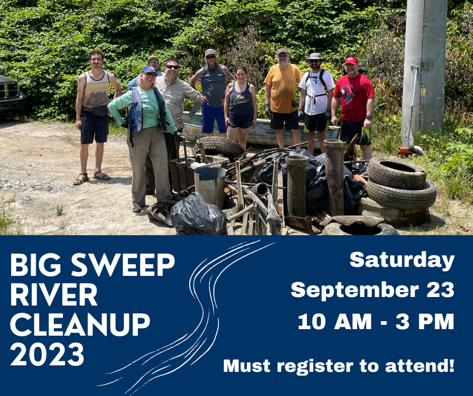 Volunteers standing outside after cleaning up a stream.