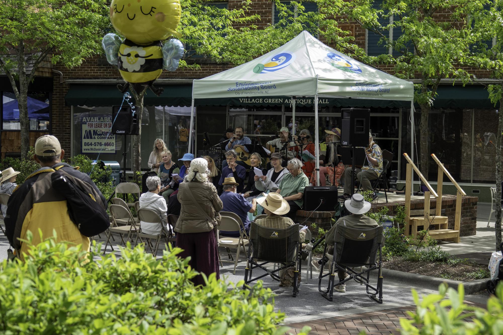 Scene of Hendo Earth Fest stage with musical acts and audience