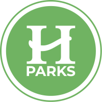 Hendersonville parks logo with green and white background