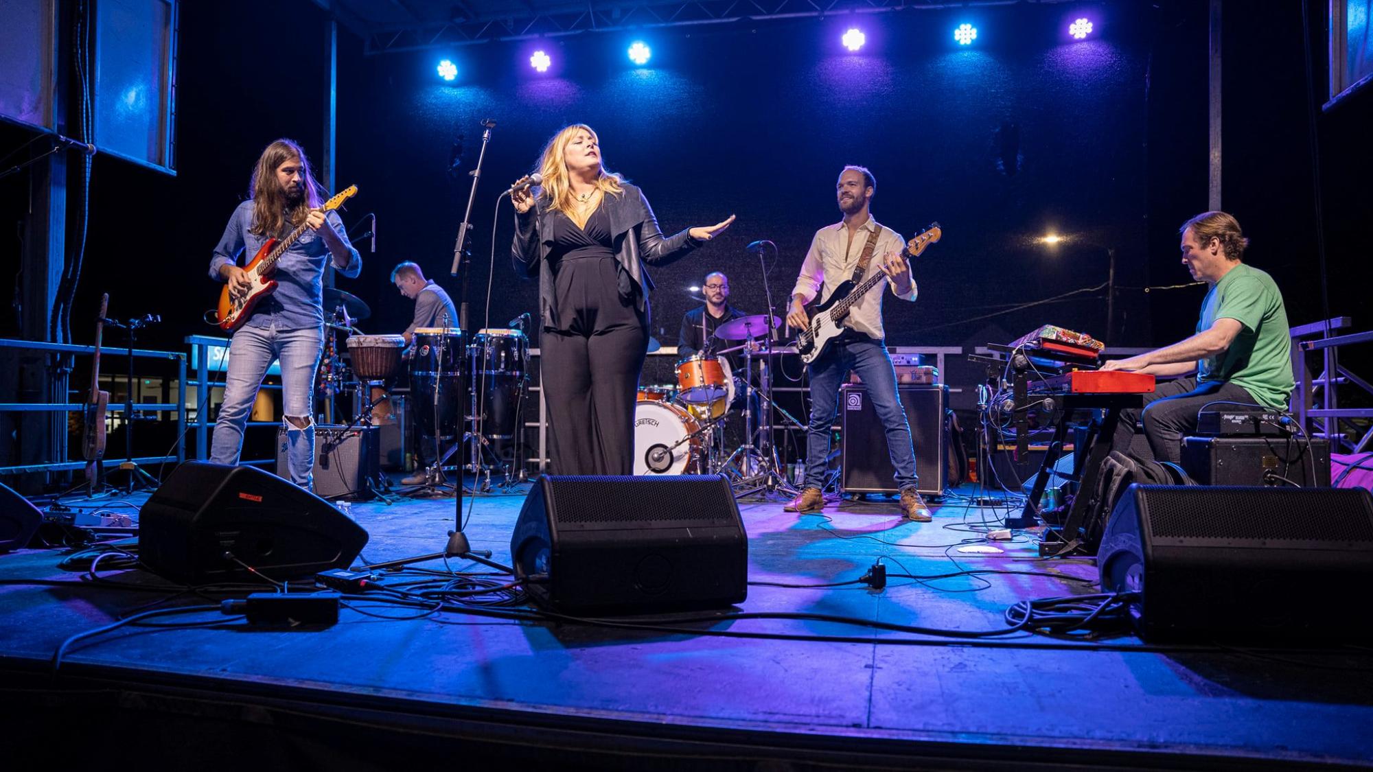 Band on stage at Rhythm and Brews