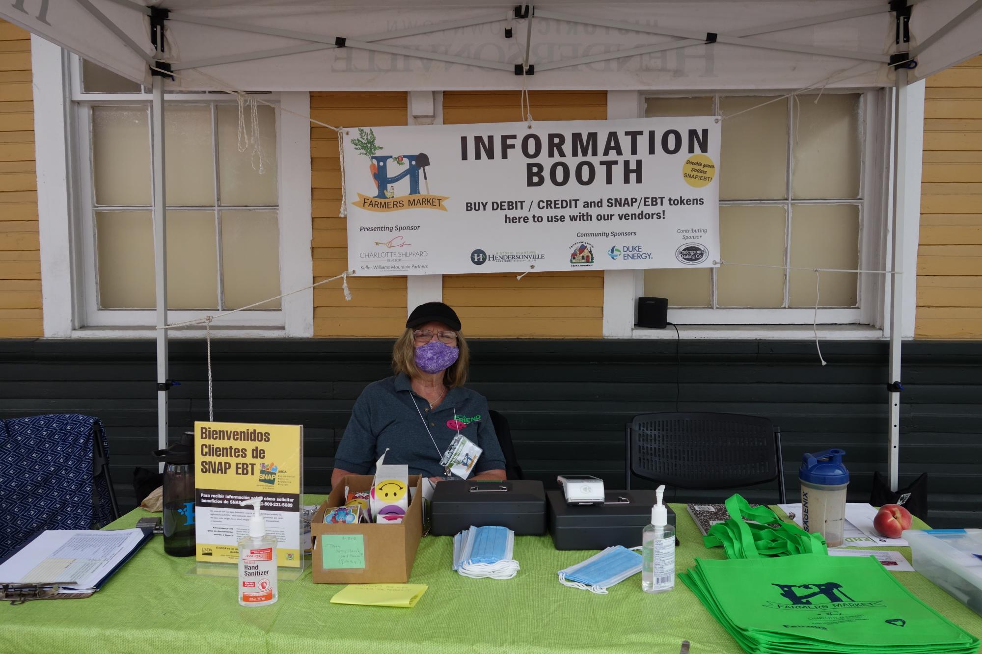 Volunteer at information booth