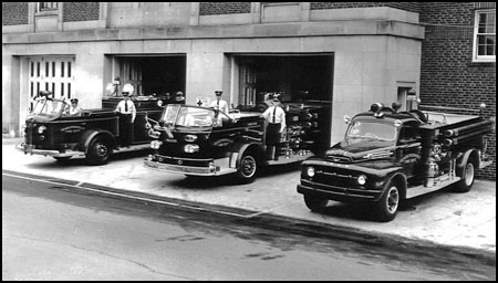 Historic fire department photo. 3 fire trucks