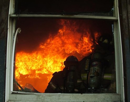 Fire and Firefighters inside a house