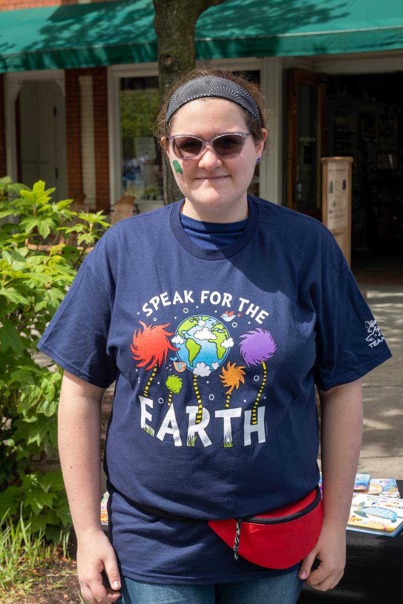 A fun and festive Earth Day participant spreads the message of protecting our earth.