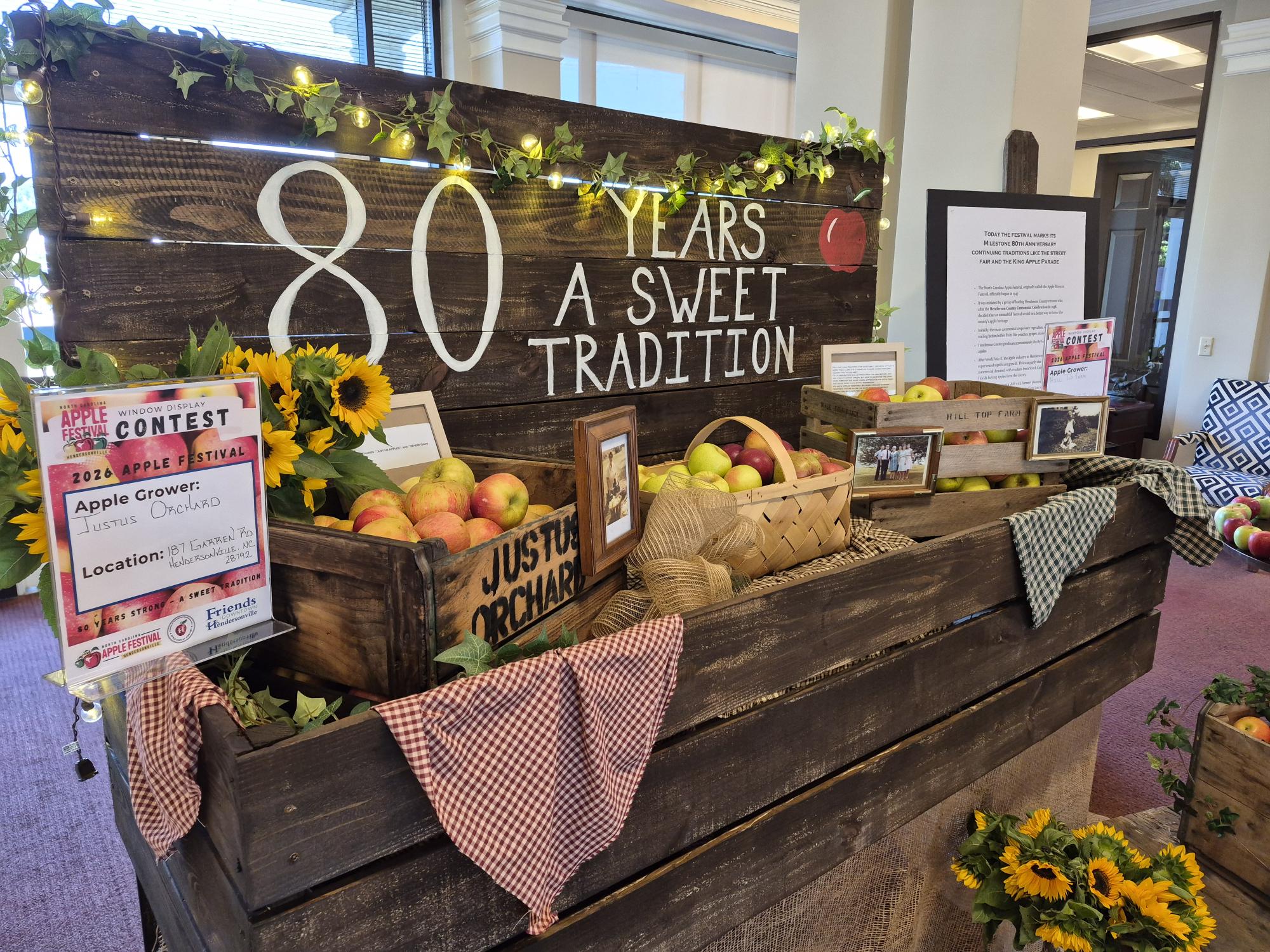 image of apple display that features text that says 80 years, a sweet tradition, with apples